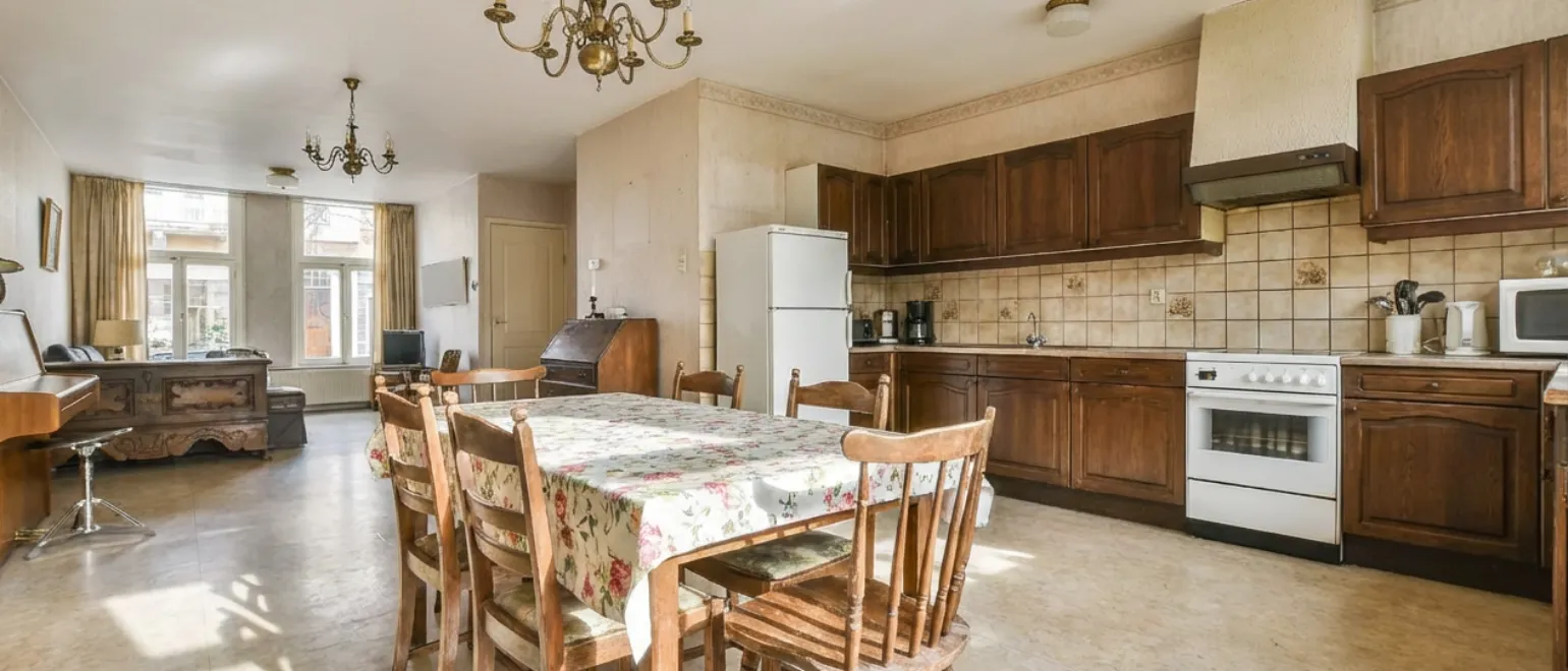 Before kitchen remodeling project in Los Angeles showing outdated cabinets, closed layout, and old appliances