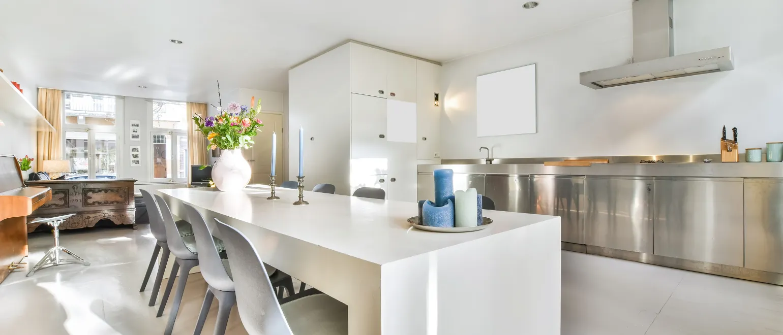 Modern kitchen remodeling project in Los Angeles featuring open layout, large island, custom cabinets, and contemporary finishes