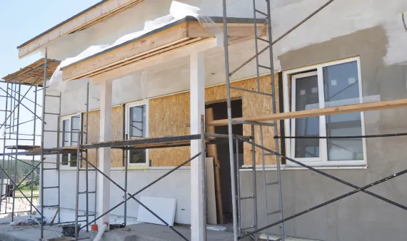 Exterior remodeling in Los Angeles with stucco facade renovation and scaffolding construction work